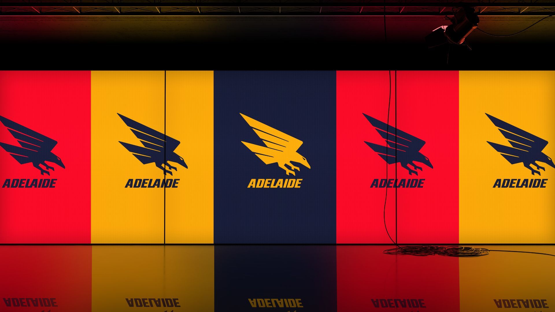 Tri-coloured Crows logos displayed on a large LED screen