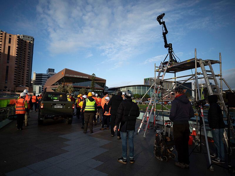 Fuller team and talent on location near the convention centre bridge