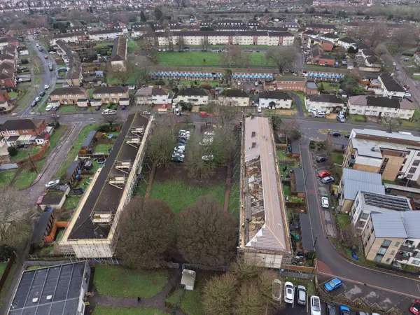 Aerial view across Fernside Close showing both scaffolded residential blocks and the wider Southampton housing estate during roof renewal.