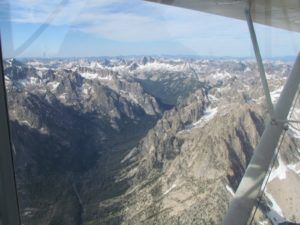 Sawtooth mountains from plane window Stanley, ID | Stanley Chambers
