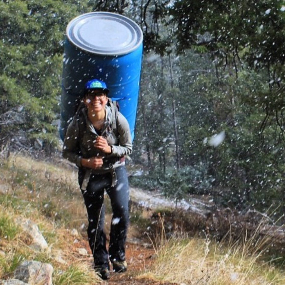 Hiker with big blue barrel pack | Stanley chamber