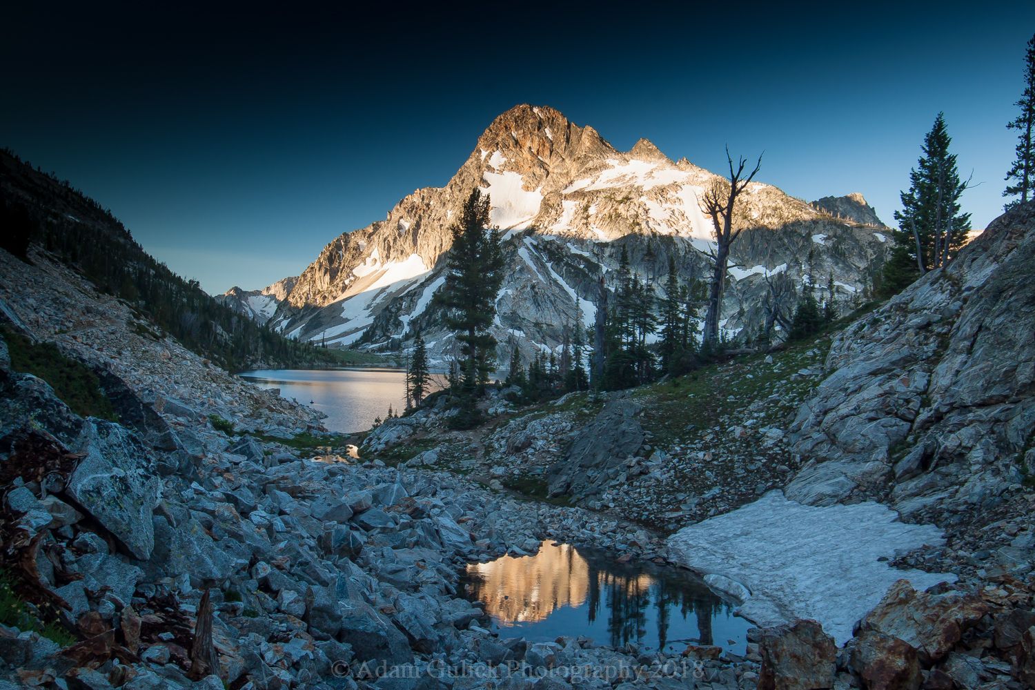 Sawtooth Lake dusted with snow in Stanley, ID | Stanley Chambers