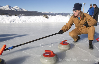 A woman curling on ice | Stanley Chamber
