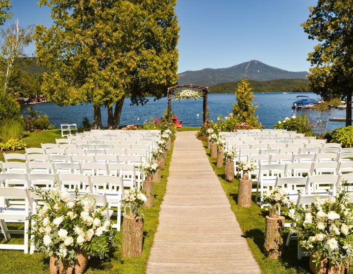 Aisle and chairs set up on a lake for a wedding