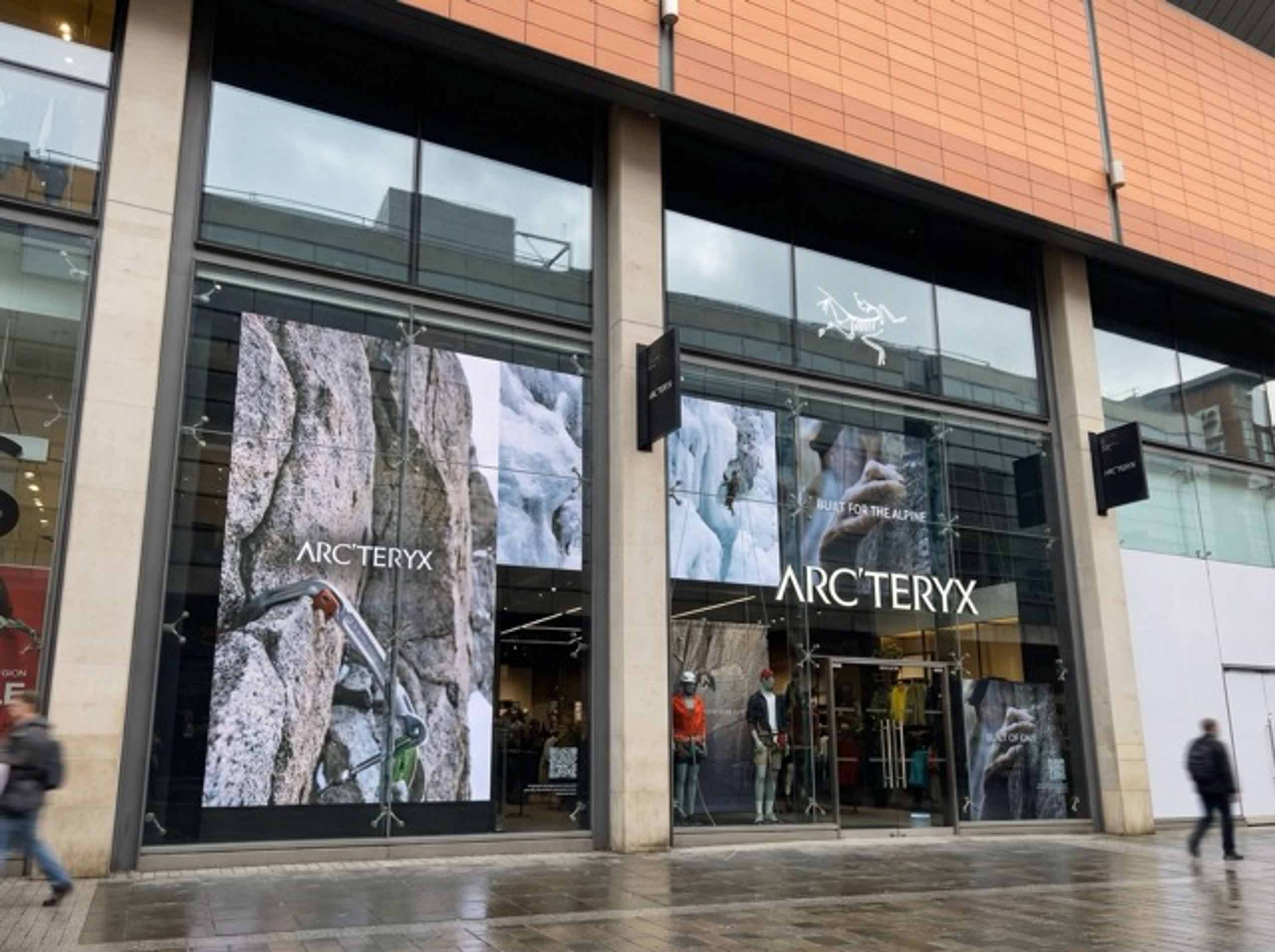 High-brightness LED window display seen from the pavement outside a shopfront.