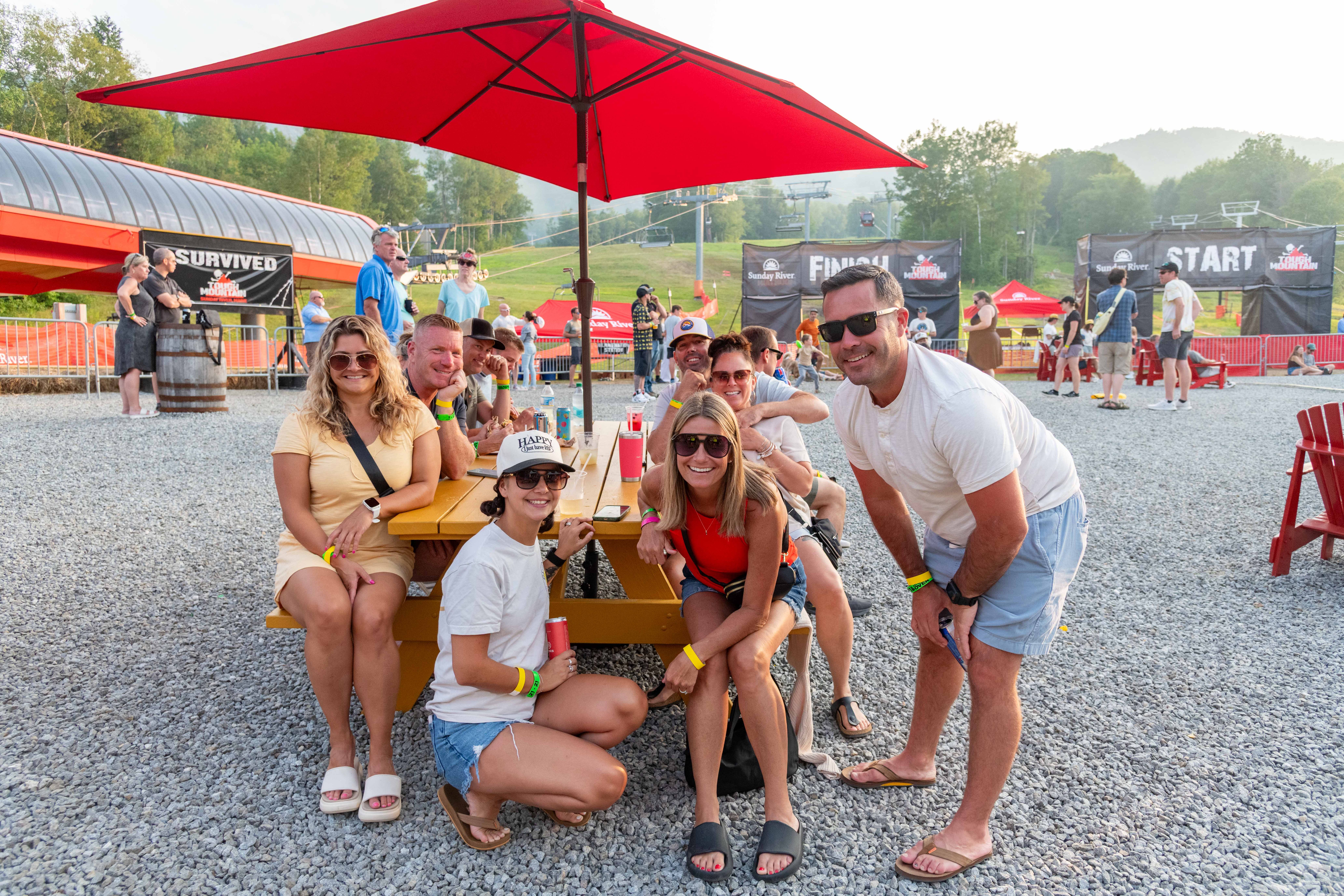 People hanging out and posing for a group photo.