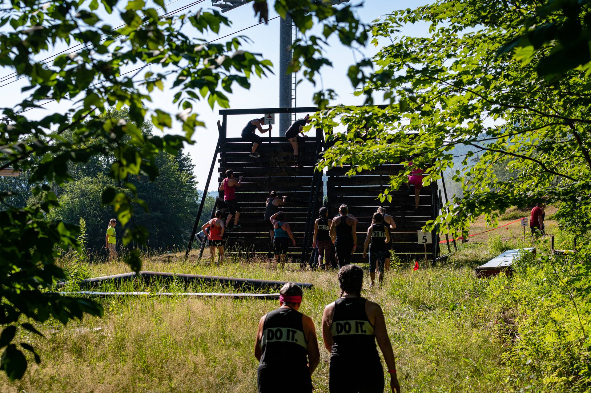 Tough Mountain Challenge participants looking running towards an obstacle.