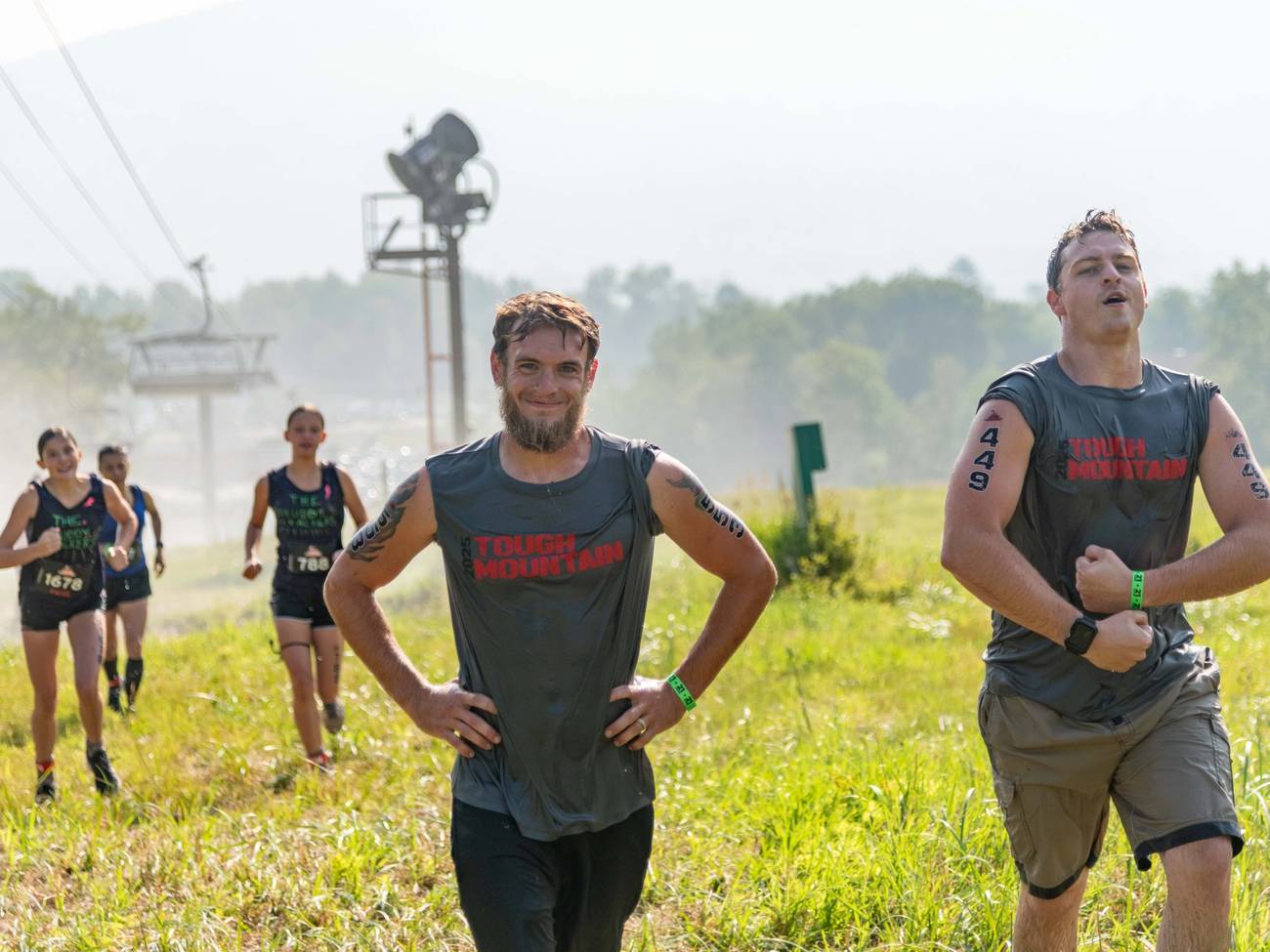 Tough Mountain competitors flexing and smiling.