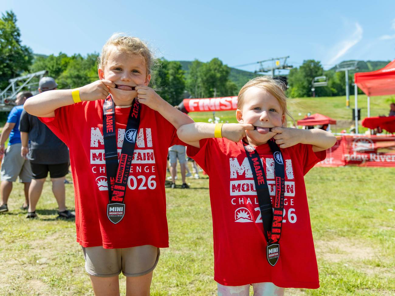 Mini Mountain Challenge competitor receiving her medal