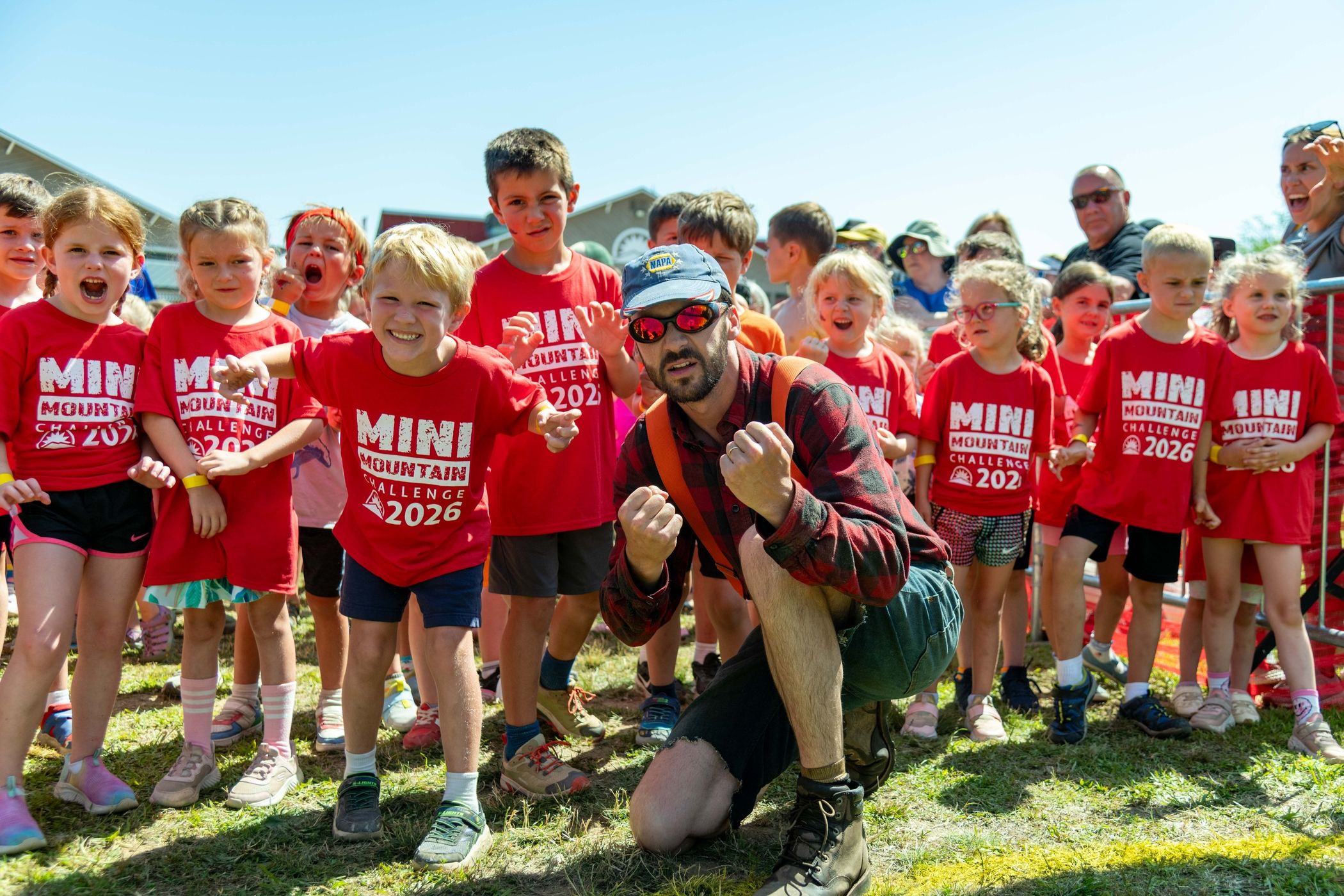 Mini Mountain competitors smiling at the start area.