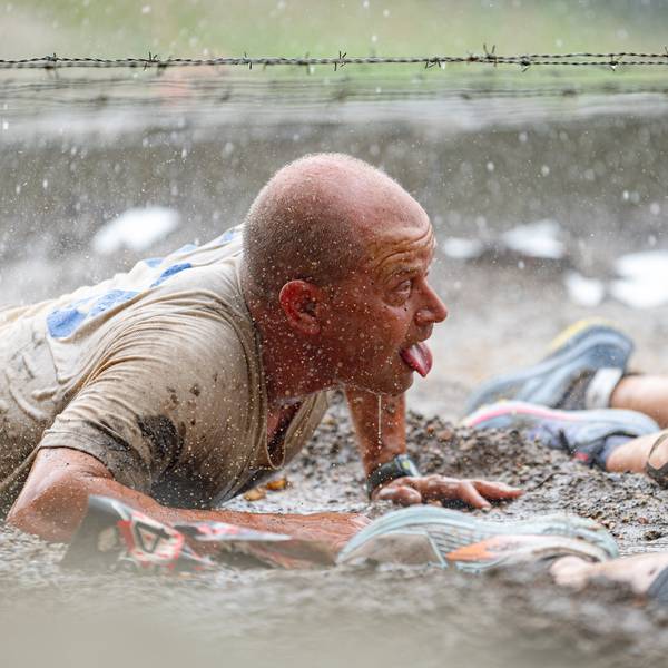 A man in the mud at Tough Mountain Challenge