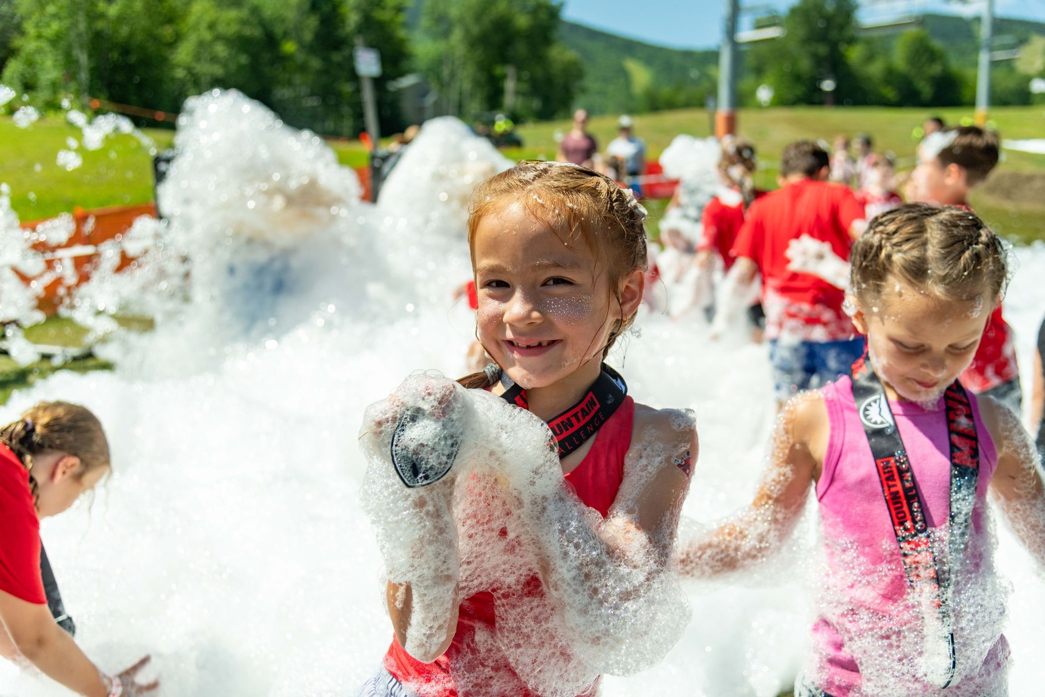 Mini Mountain Challenge racer playing in the foam.