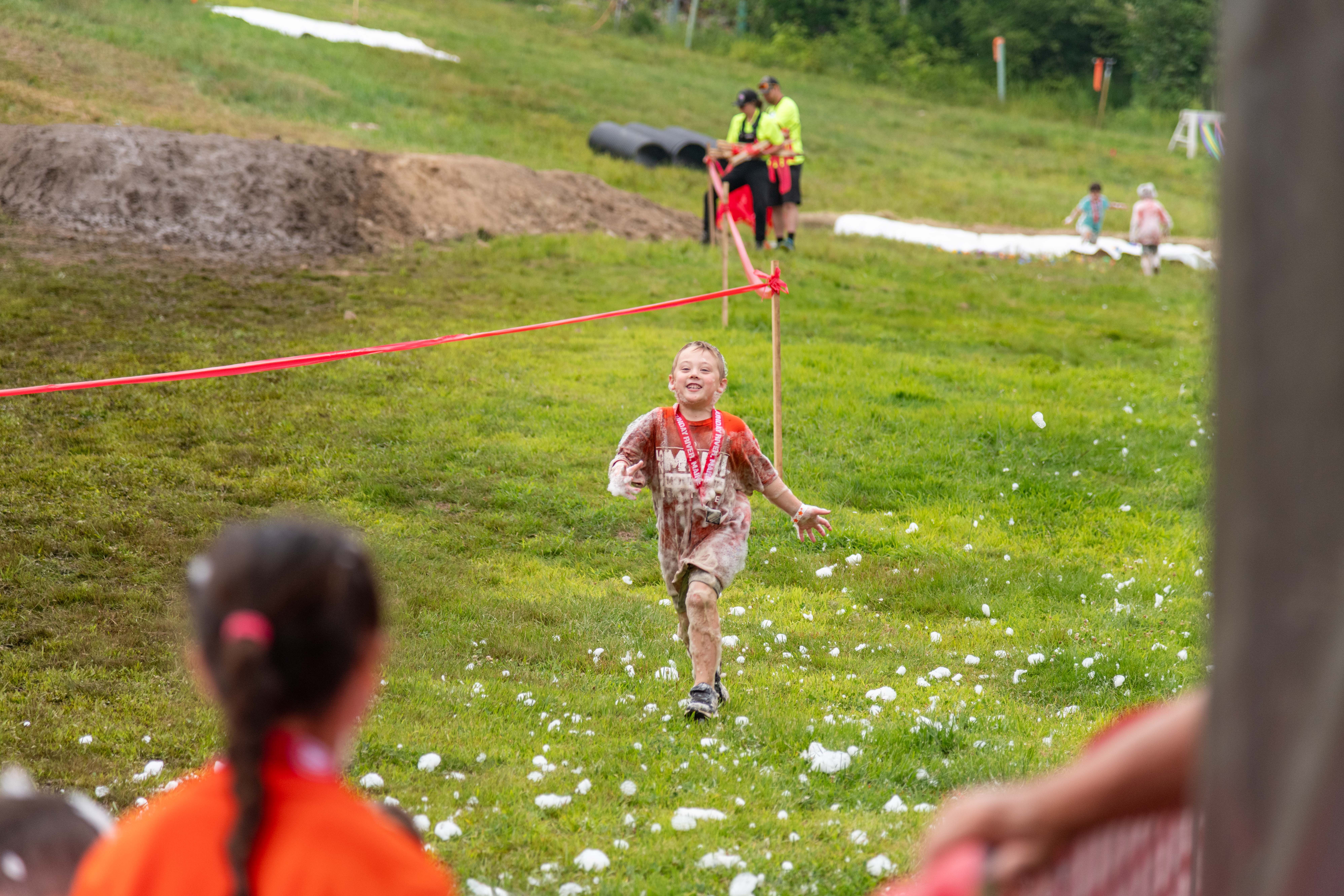 Young competitors going through the finish at the Mini Mountain Challenge.