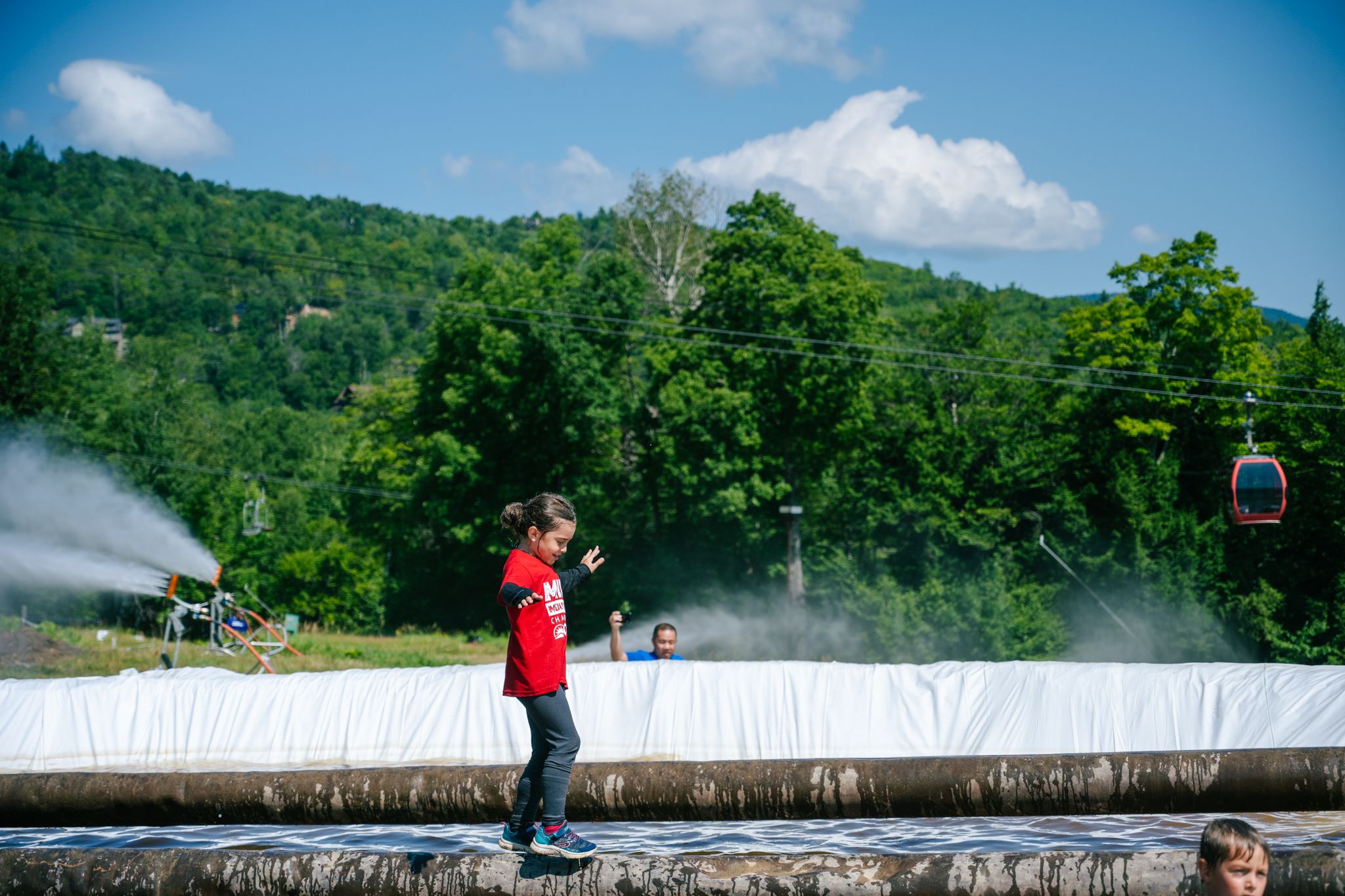Mini Mountain racer walking across a balance beam.
