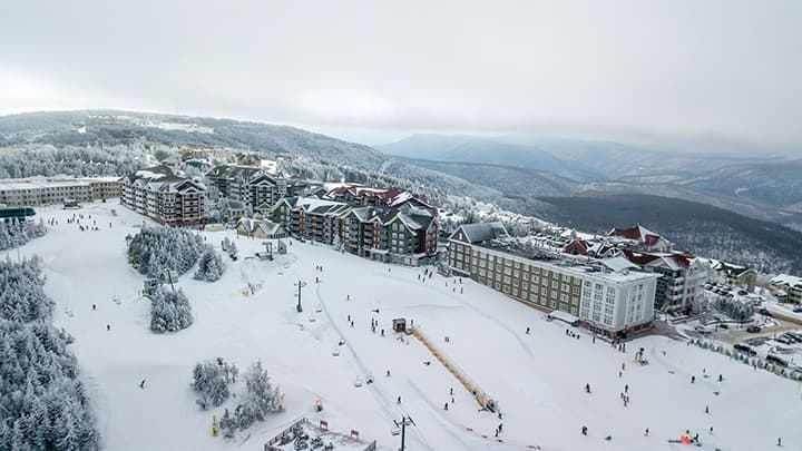 Aerial view of snow covered ski resort.