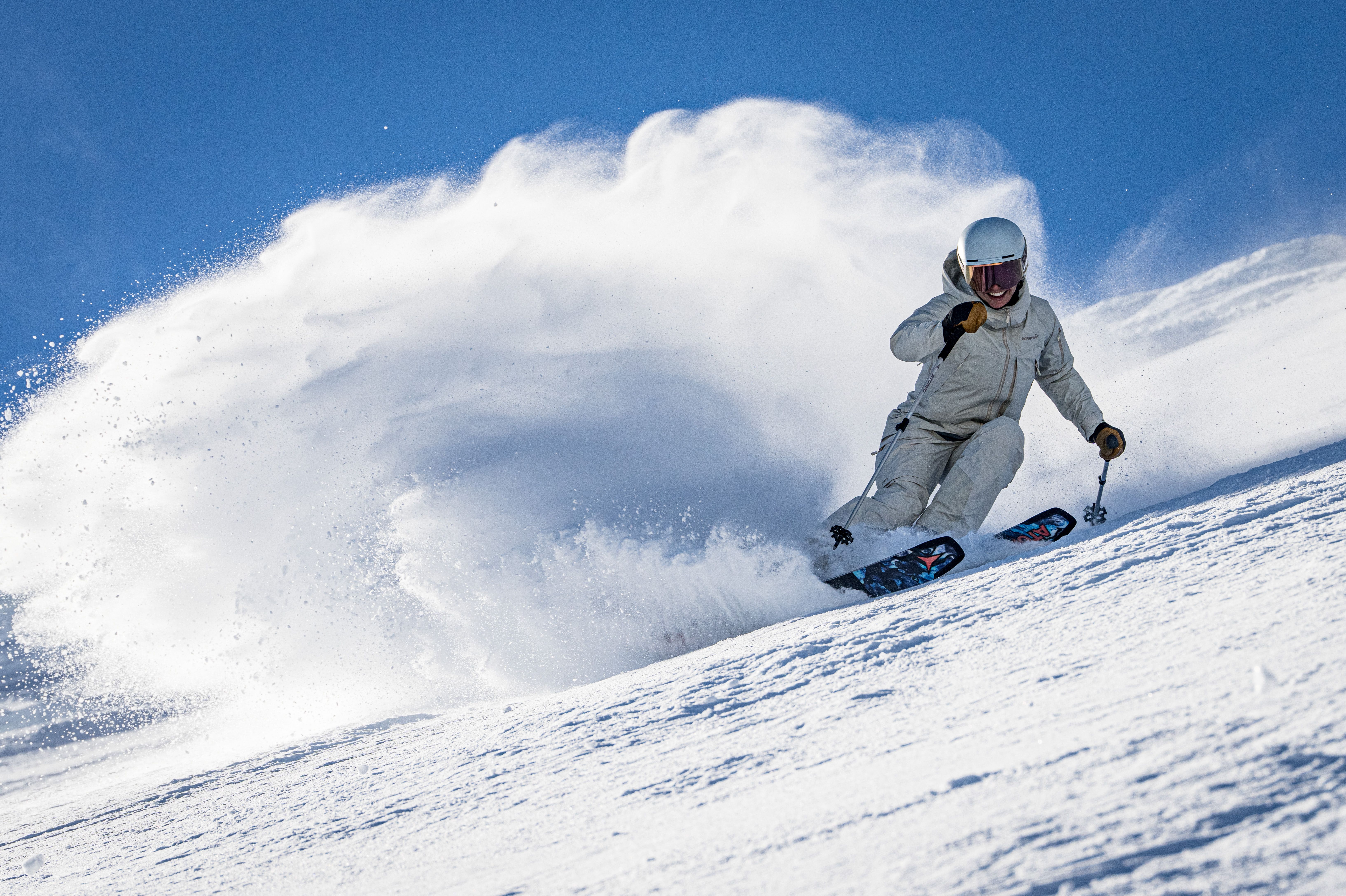 Skier going down a ski hill