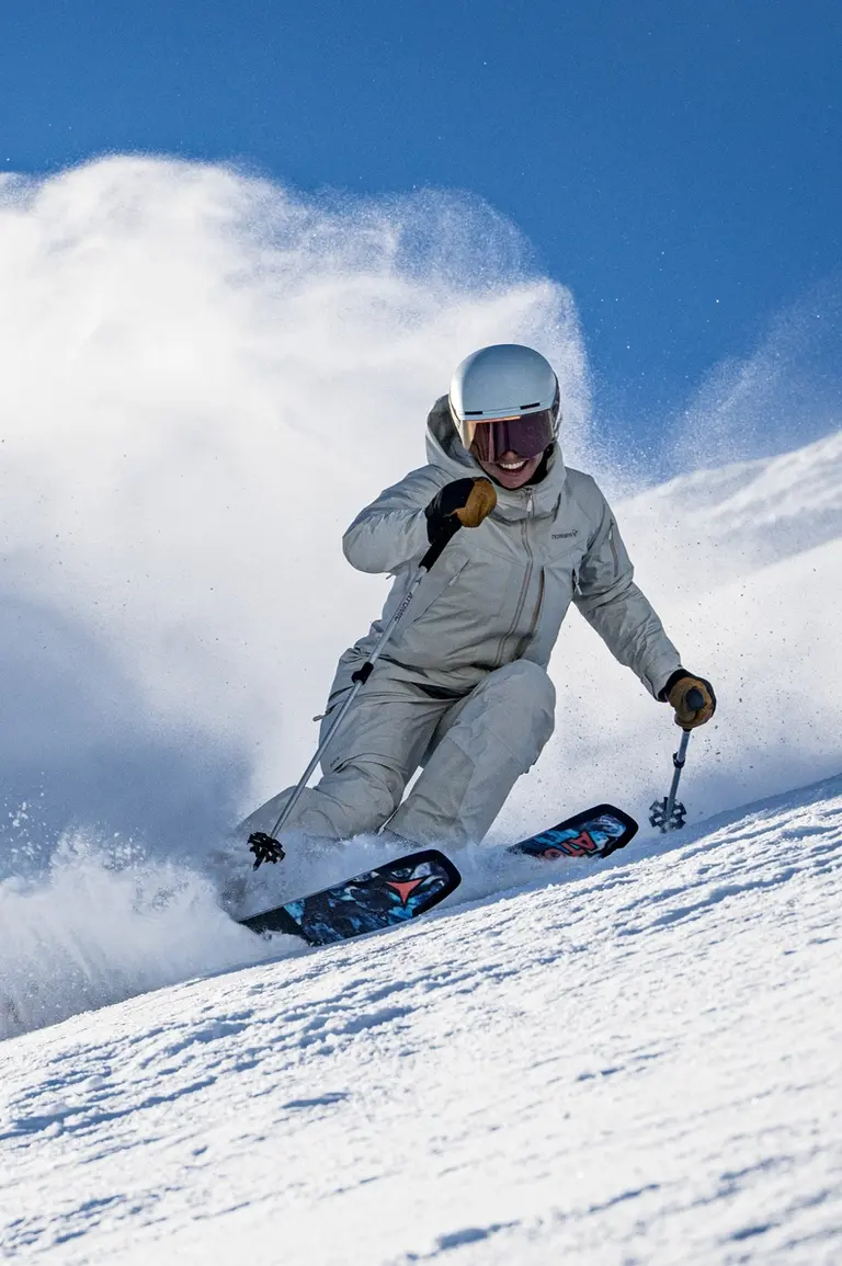 Skier going down a ski hill