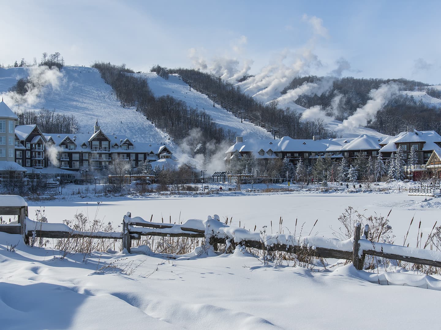 Winter landscape of resort at the base of a mountain.