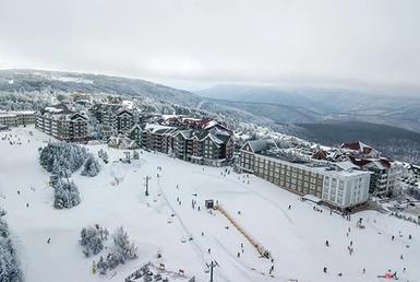 Aerial view of snow covered ski resort.