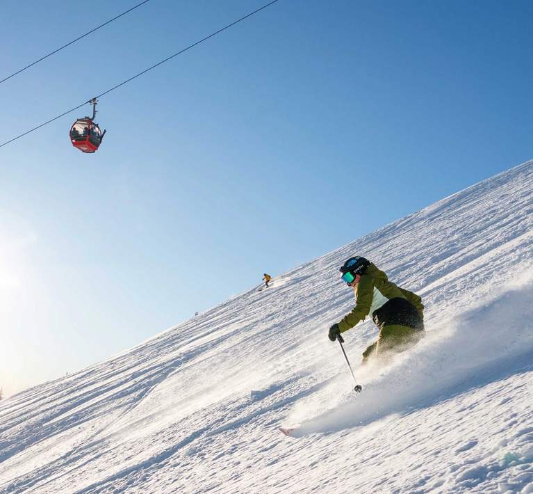 Skier with Mt Rainier Gondola at Crystal