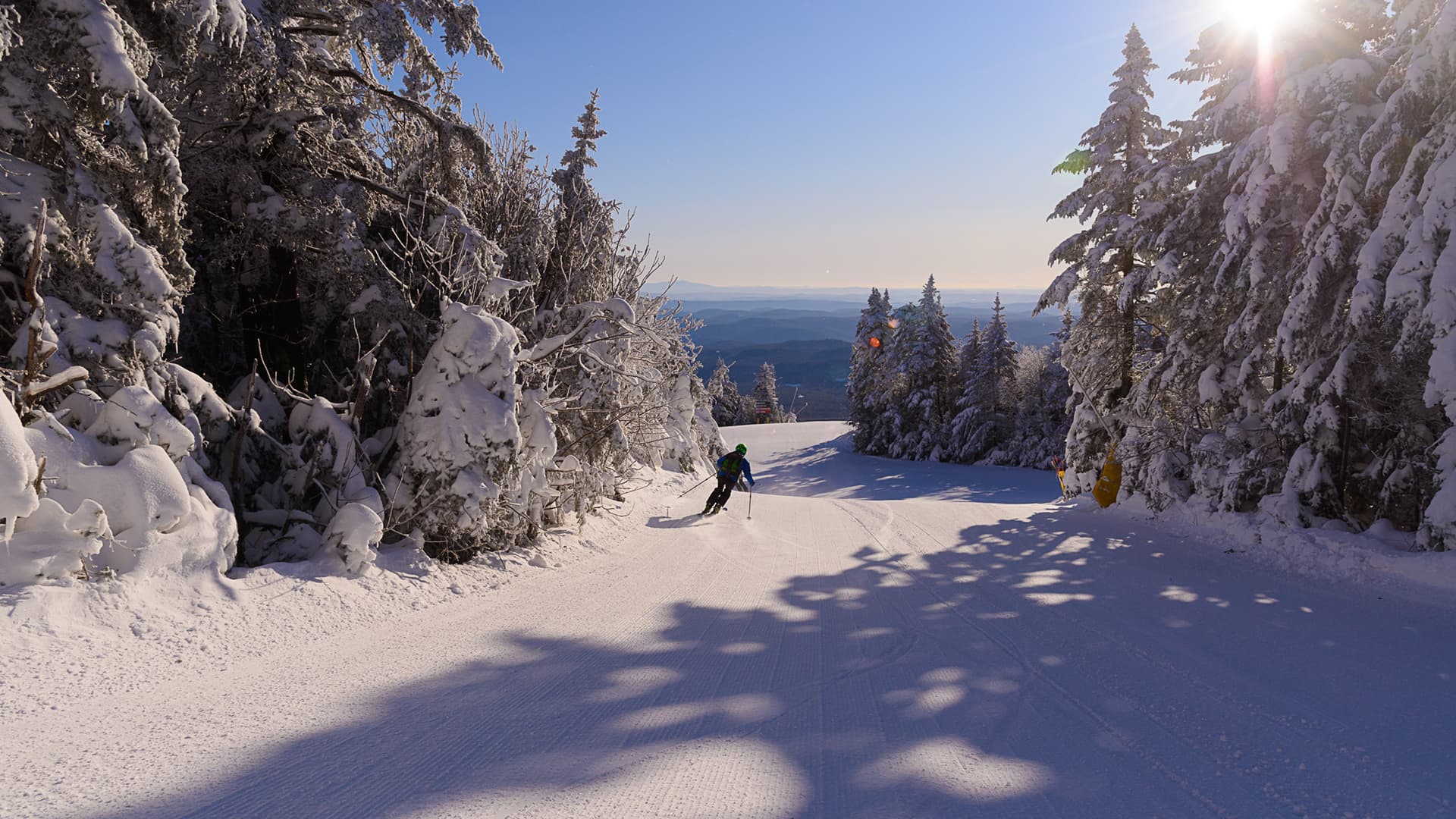 Skier making tracks on a downhill run.