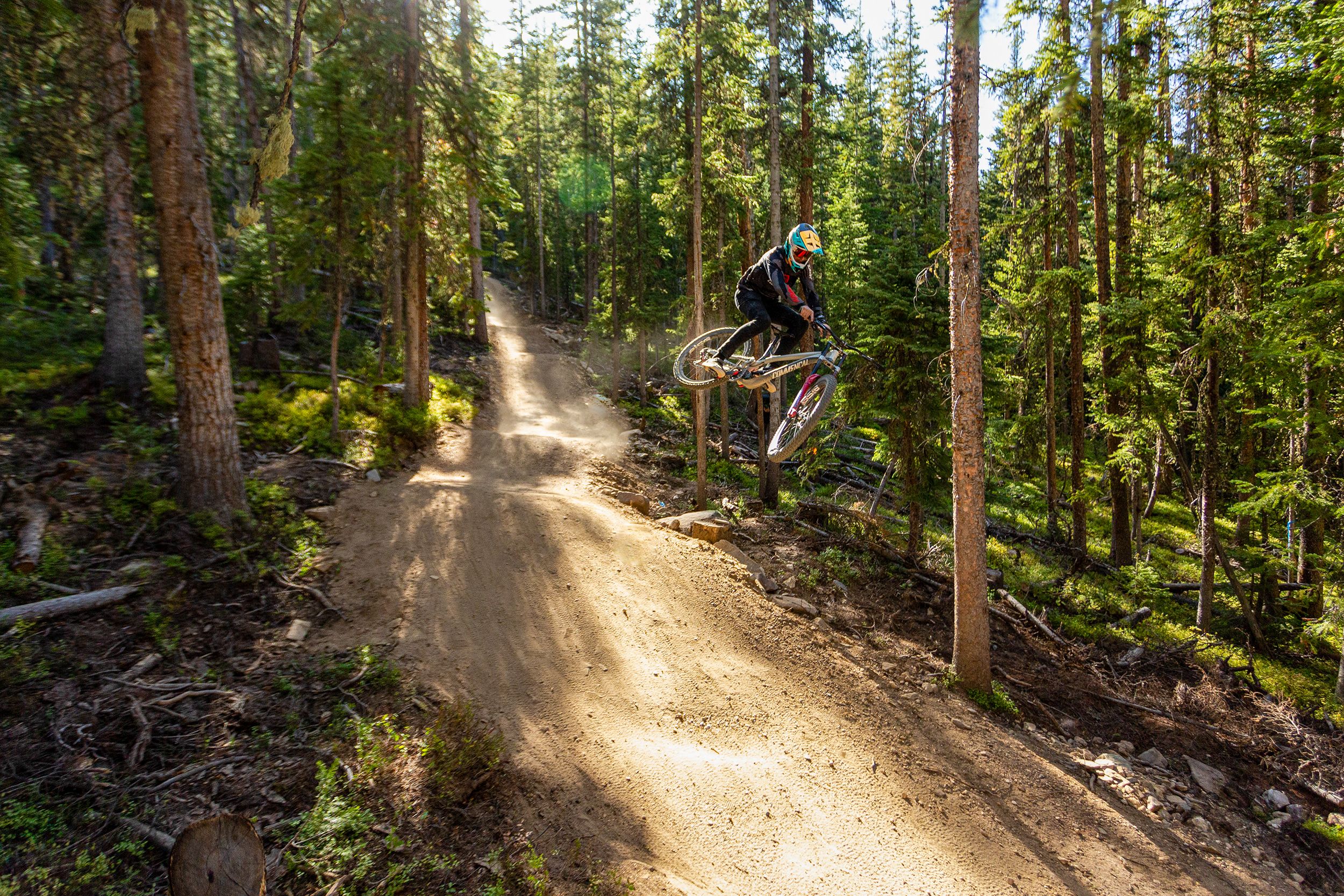 Mountain biker going off jump at Trestle Bike Park
