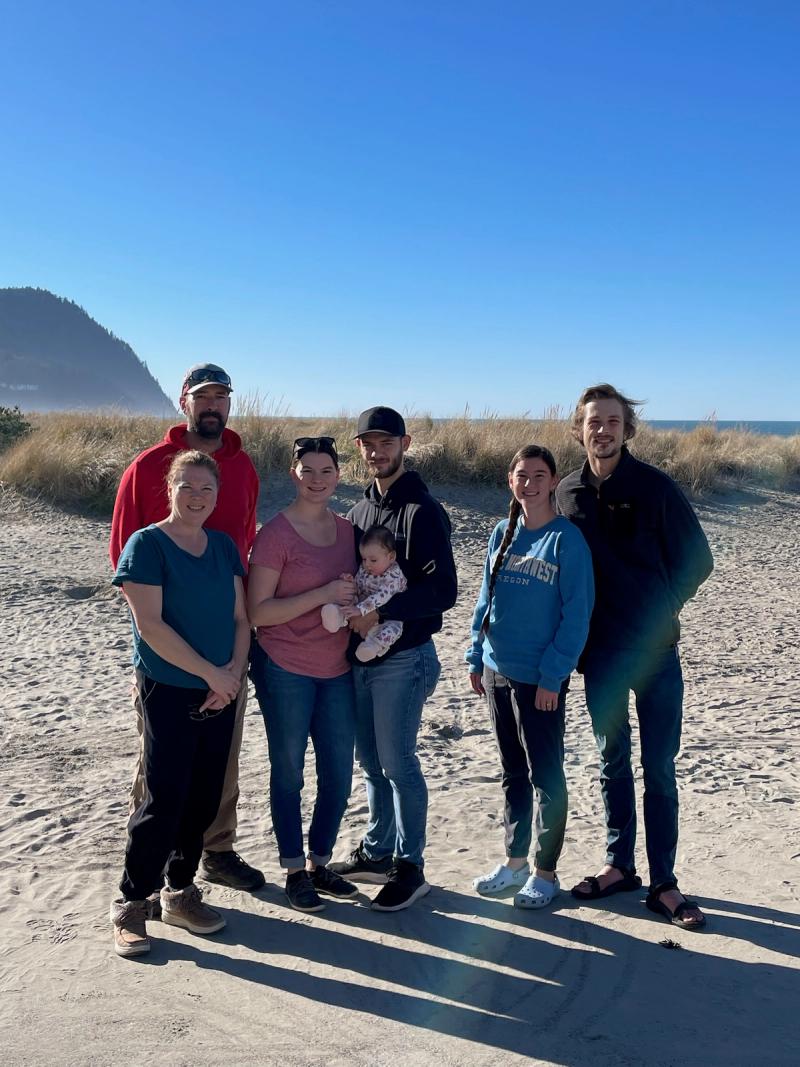 Mike and Lisa with family on the Oregon coast.