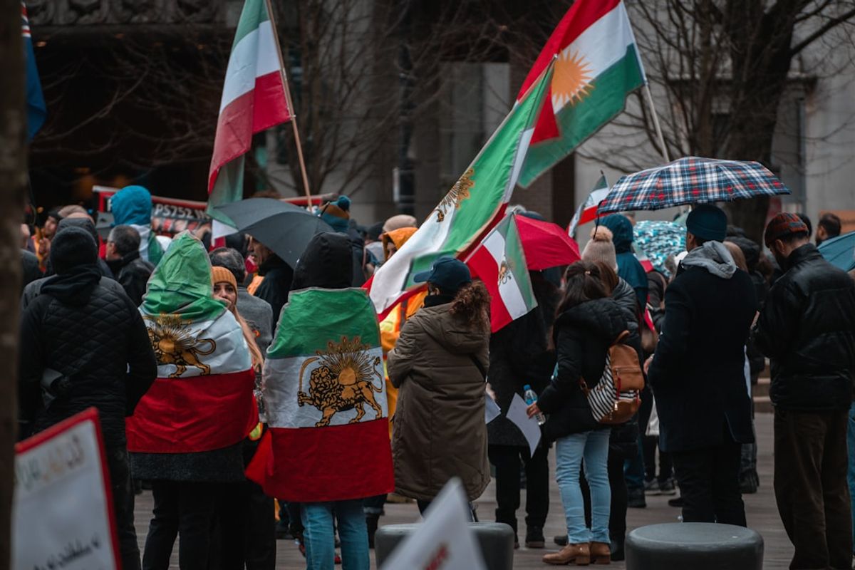 Iran War Tensions Escalate Amid Primaries and Mosque Shooting