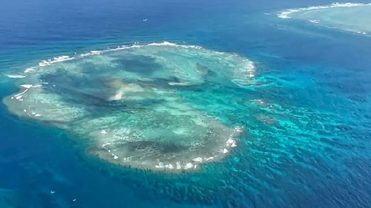 A US Warship Sails Into China's Claim: Fishermen Face the Brunt of a Naval Standoff