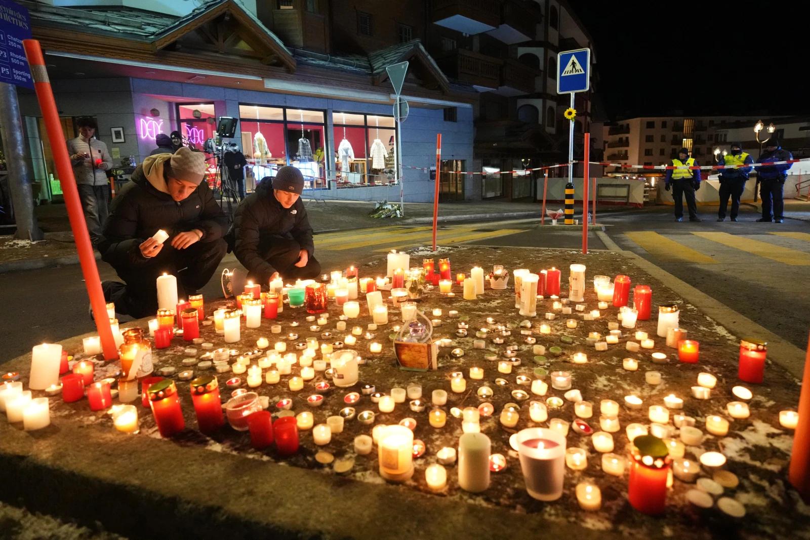 Swiss authorities detain co-owner of bar after deadly New Year’s Eve fire kills 40