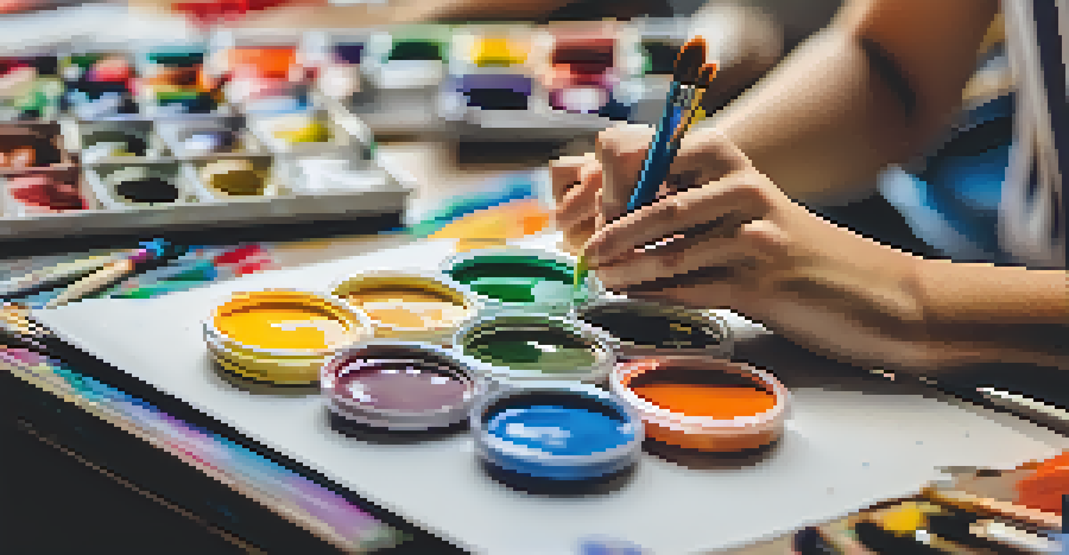 A close-up of a student's hands painting in an art class, surrounded by colorful supplies and focused students in a bright classroom.