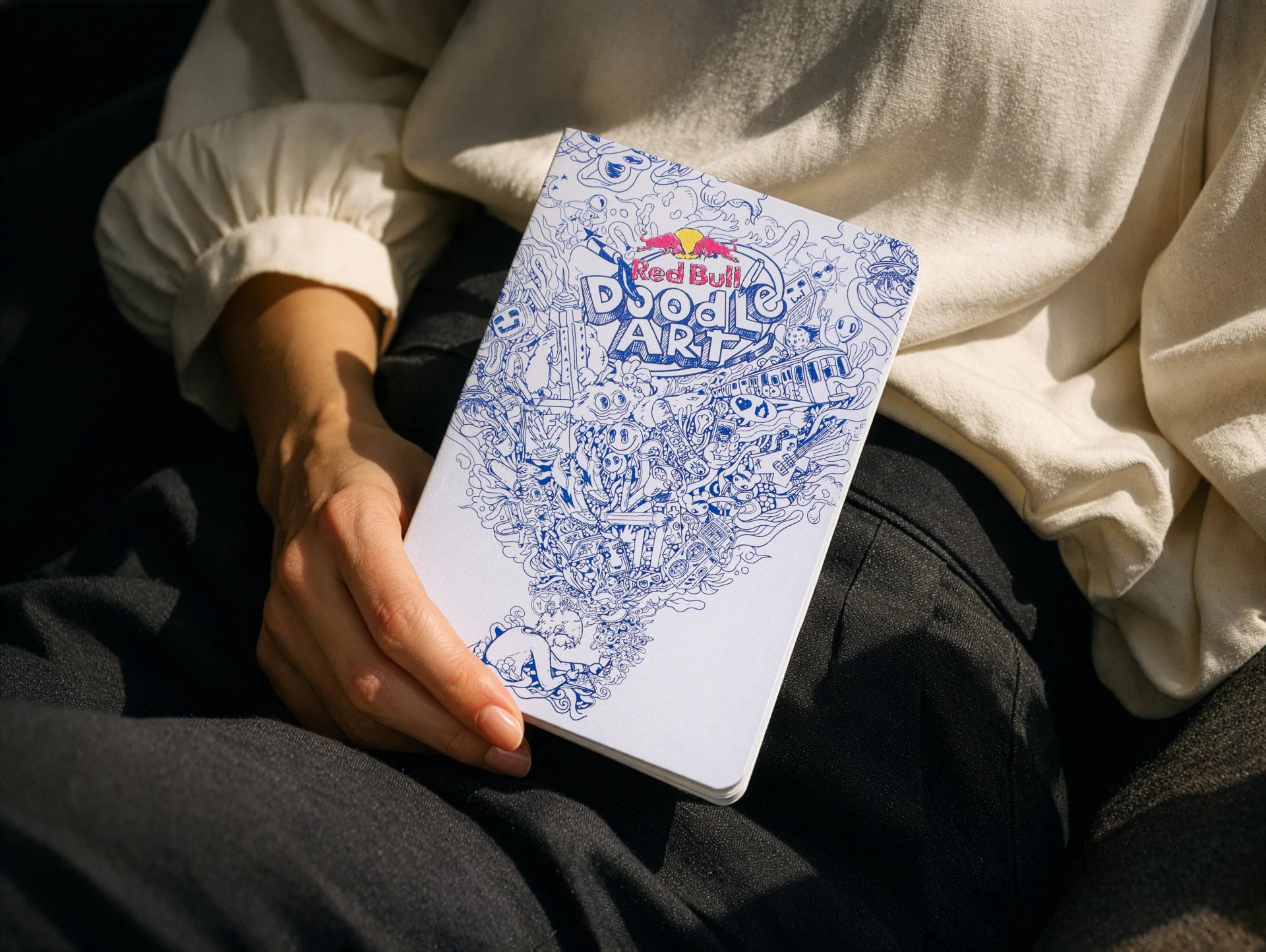Red Bull Doodle Art notebook with a blue illustration on the cover