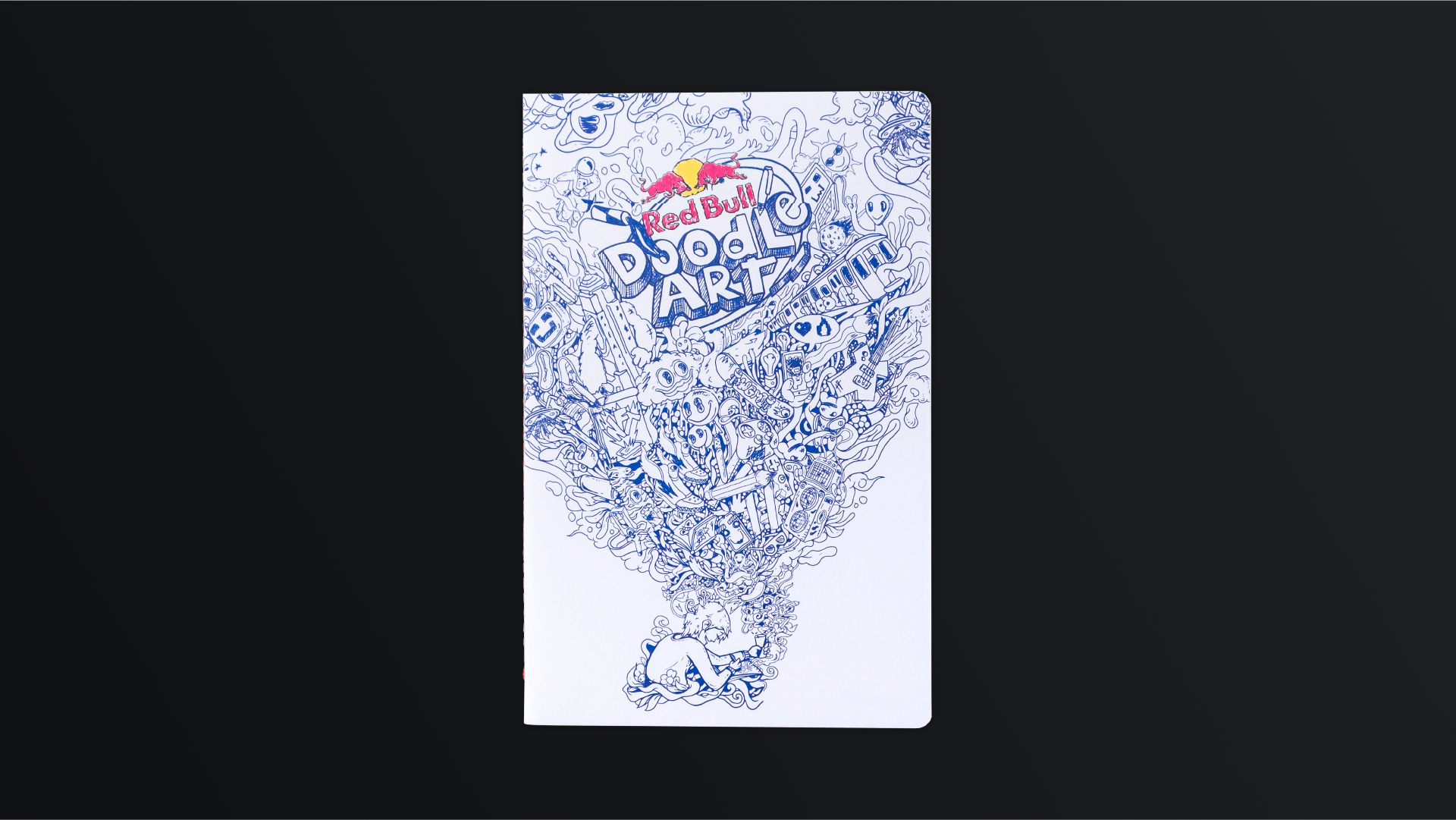 The Red Bull Doodle Art notebook from the front, a blue drawing on a white cover