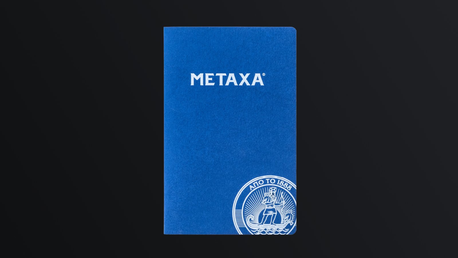 Blue corporate notebook with the Metaxa logo
