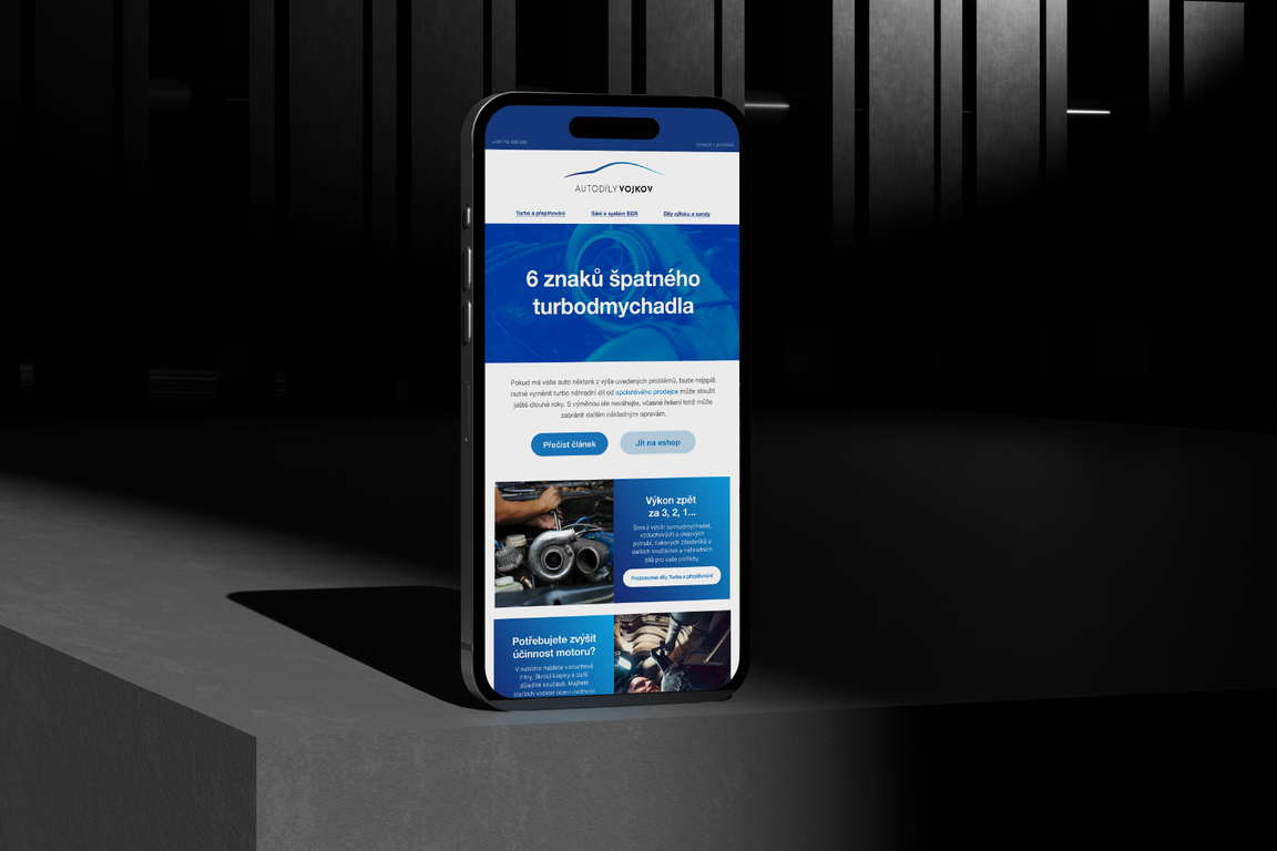 Autodíly Vojkov newsletter on a phone with an article about turbochargers
