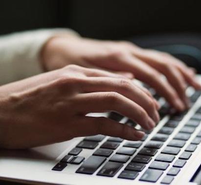 Graphic of hands typing on a keyboard