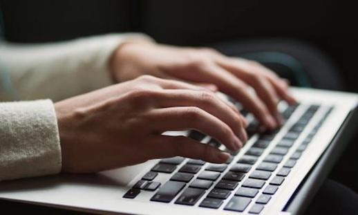 Graphic of hands typing on a keyboard