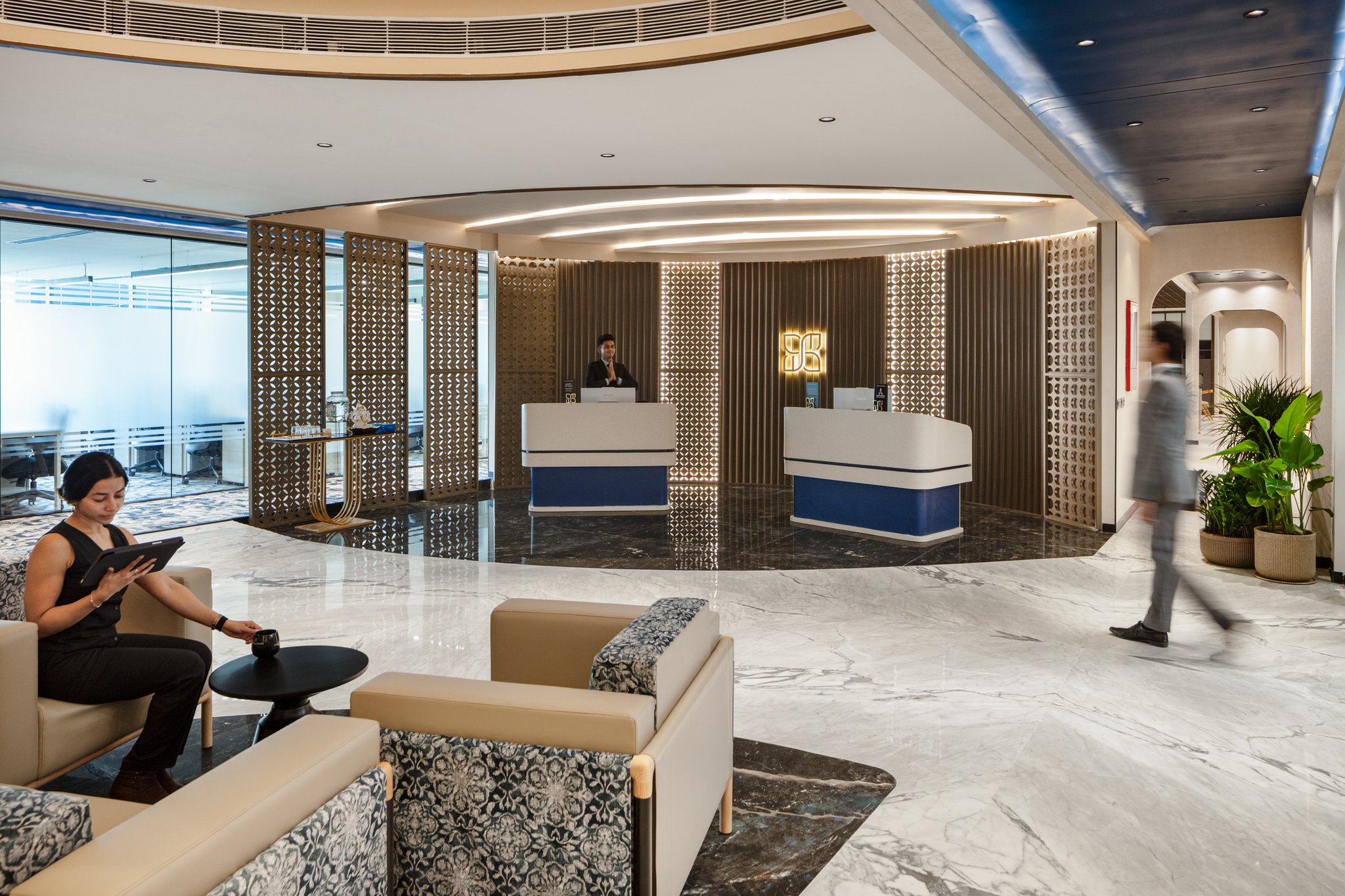 An enterprise reception with concierge welcoming guests