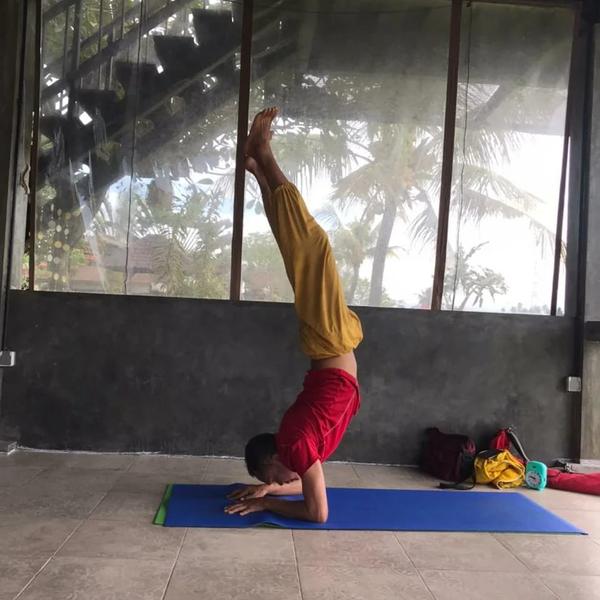 Ngurah in a yoga pose