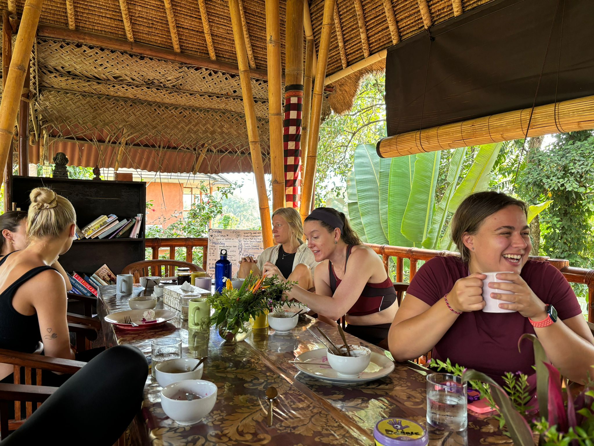 guests talking at the dining table after breakfast