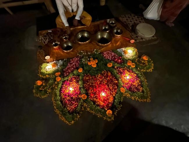 flower mandala decorating yogashala's floor, singing bowls for sound healing session