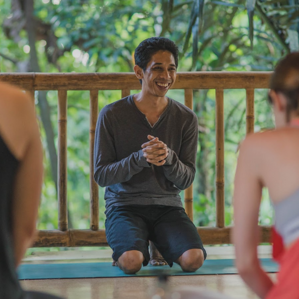Ary teaching yoga at one of shanti toya's yoga retreat