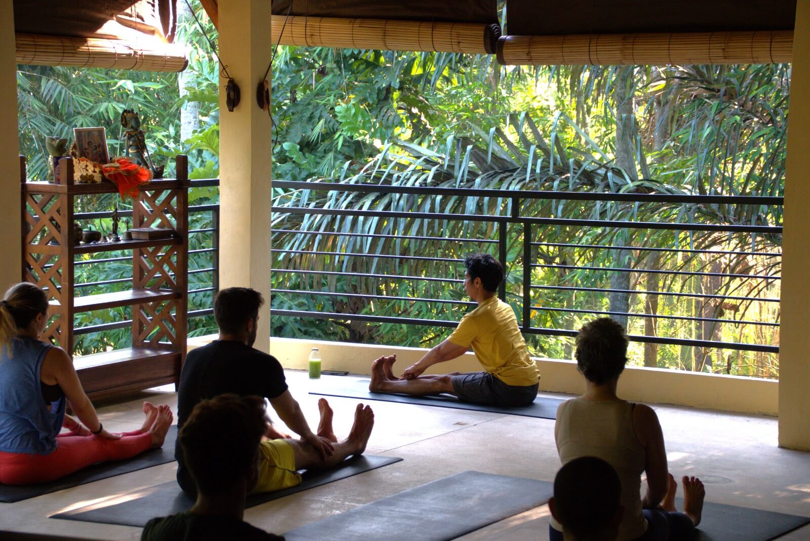 Ary/Yoga teacher showing a yoga pose to the students
