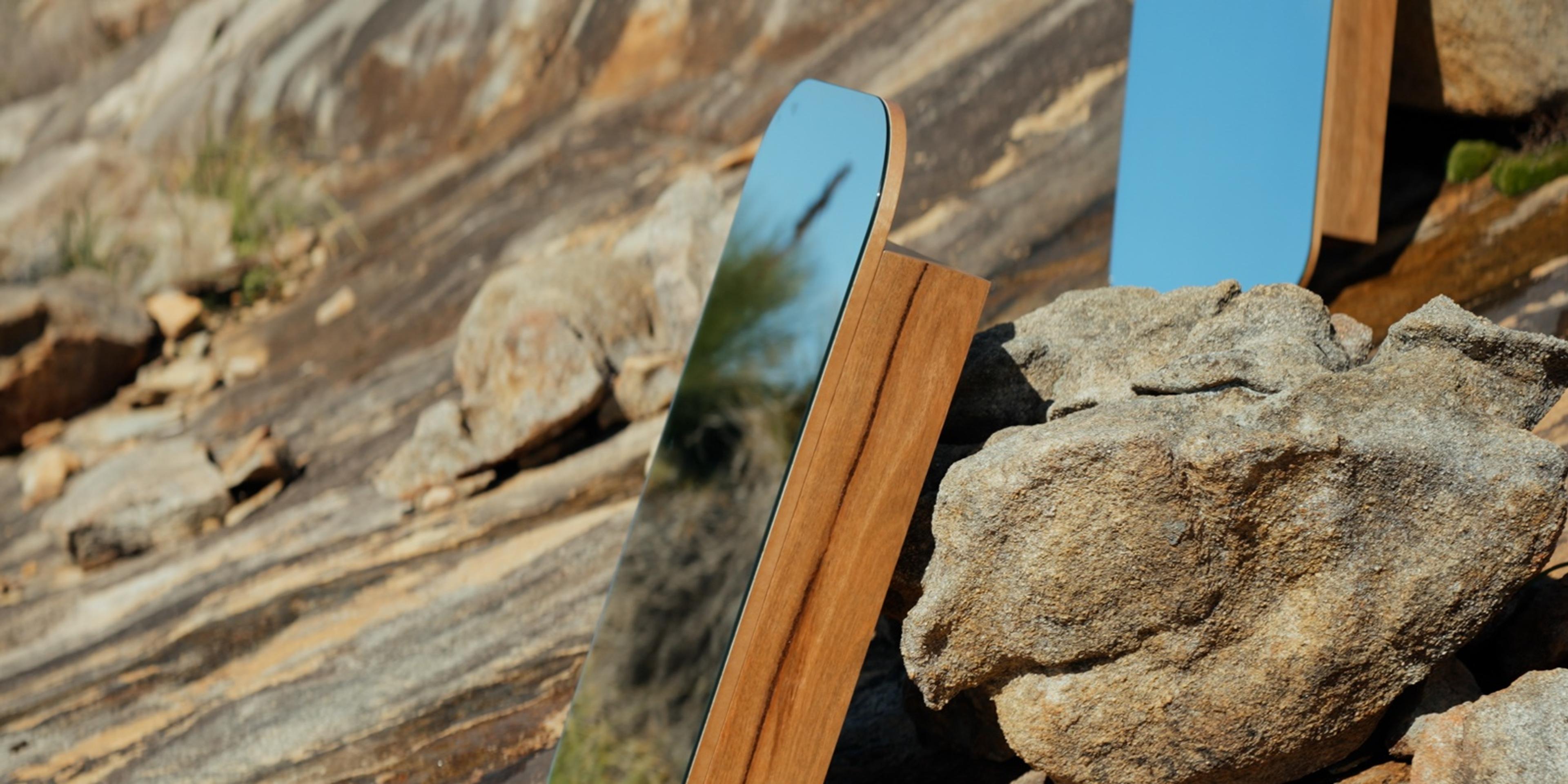 Two Shark Bay shaving cabinets leaning on granite boulders