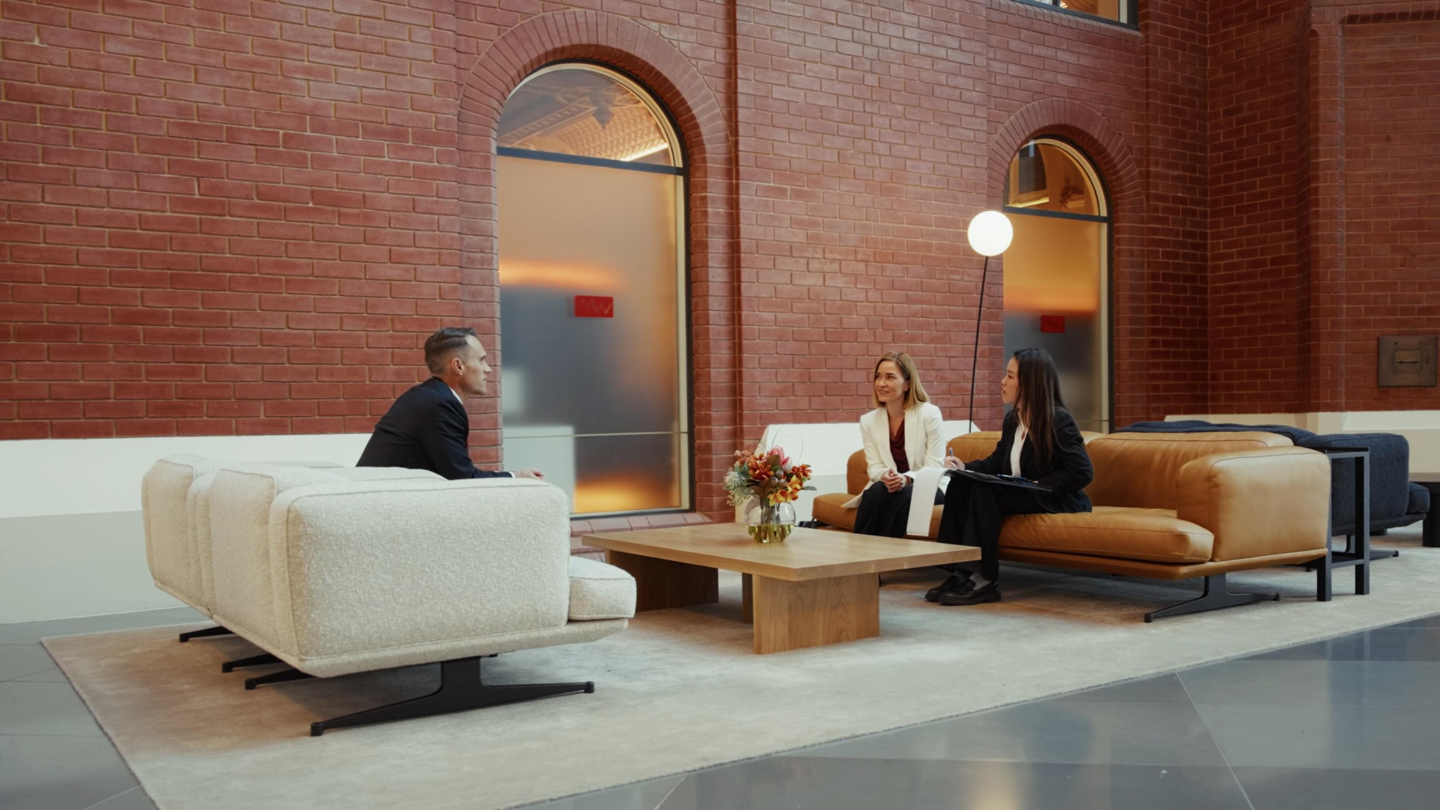 Crabtree Legal lawyers meeting clients in a light-filled atrium