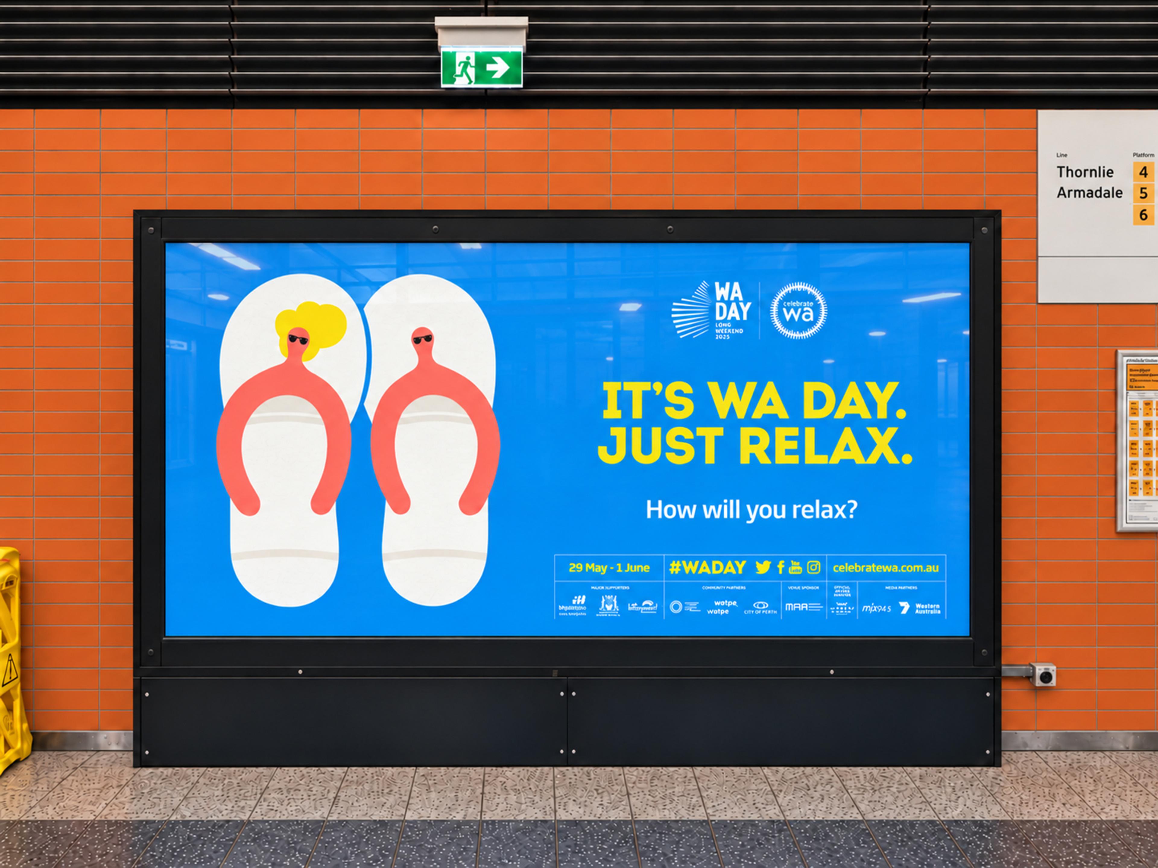 The “It’s WA Day. Just relax.” poster on a big backlit panel in Perth Underground station