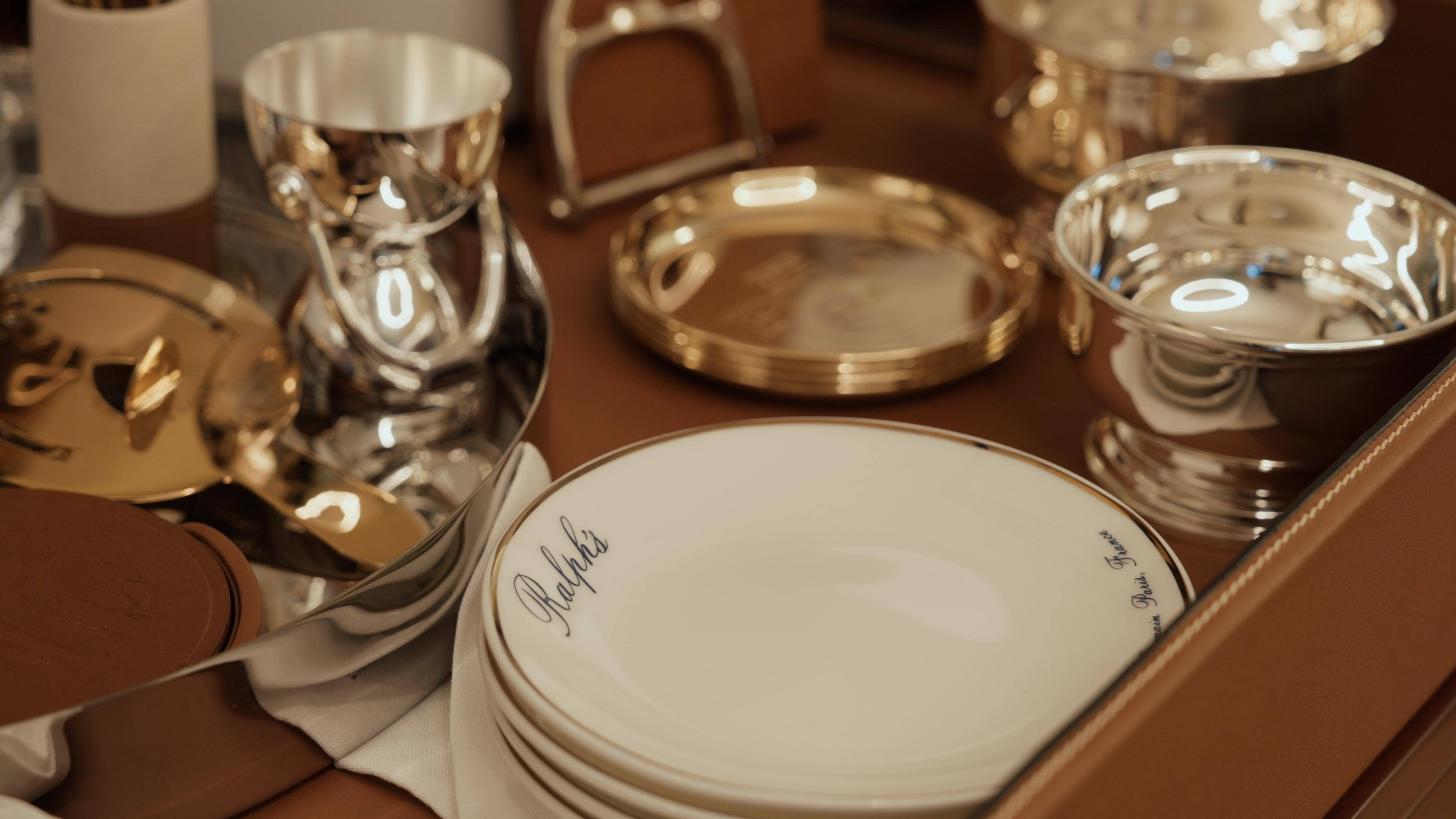 Silver bowls and Ralph’s plates on a leather tray