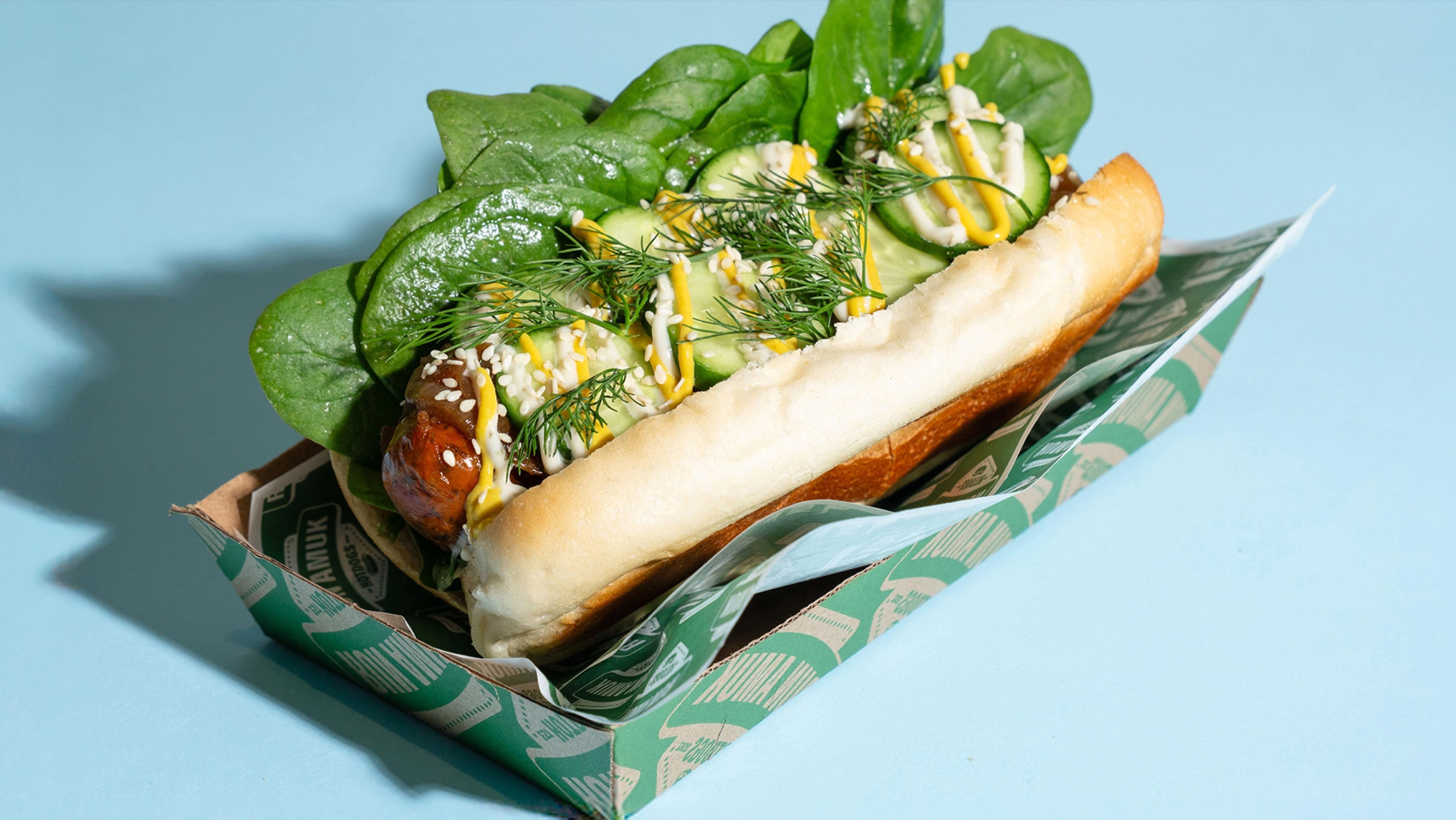 The Pickle Rick hotdog on a sky-blue backdrop