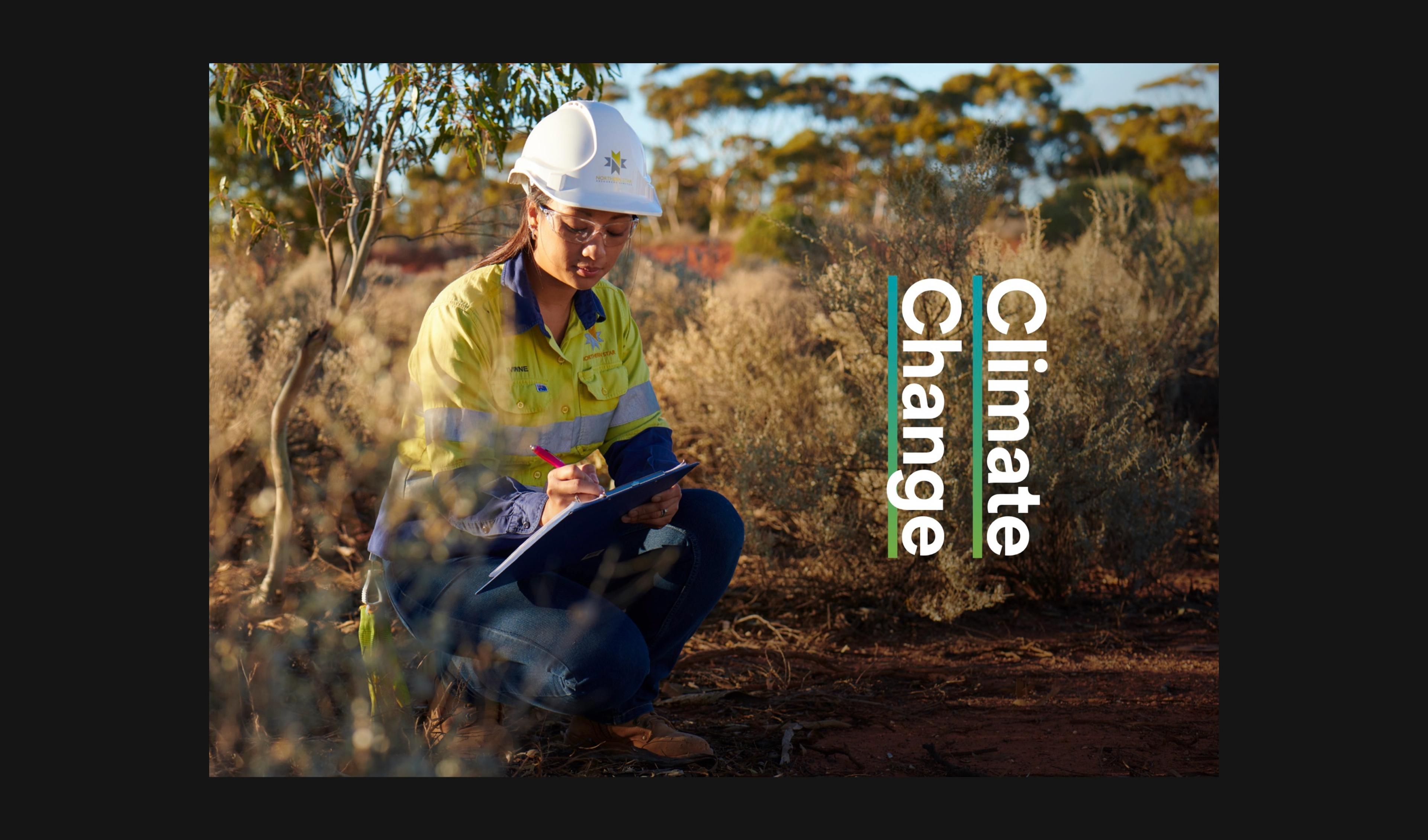 Environmental worker taking notes in the bush beside the Climate Change title