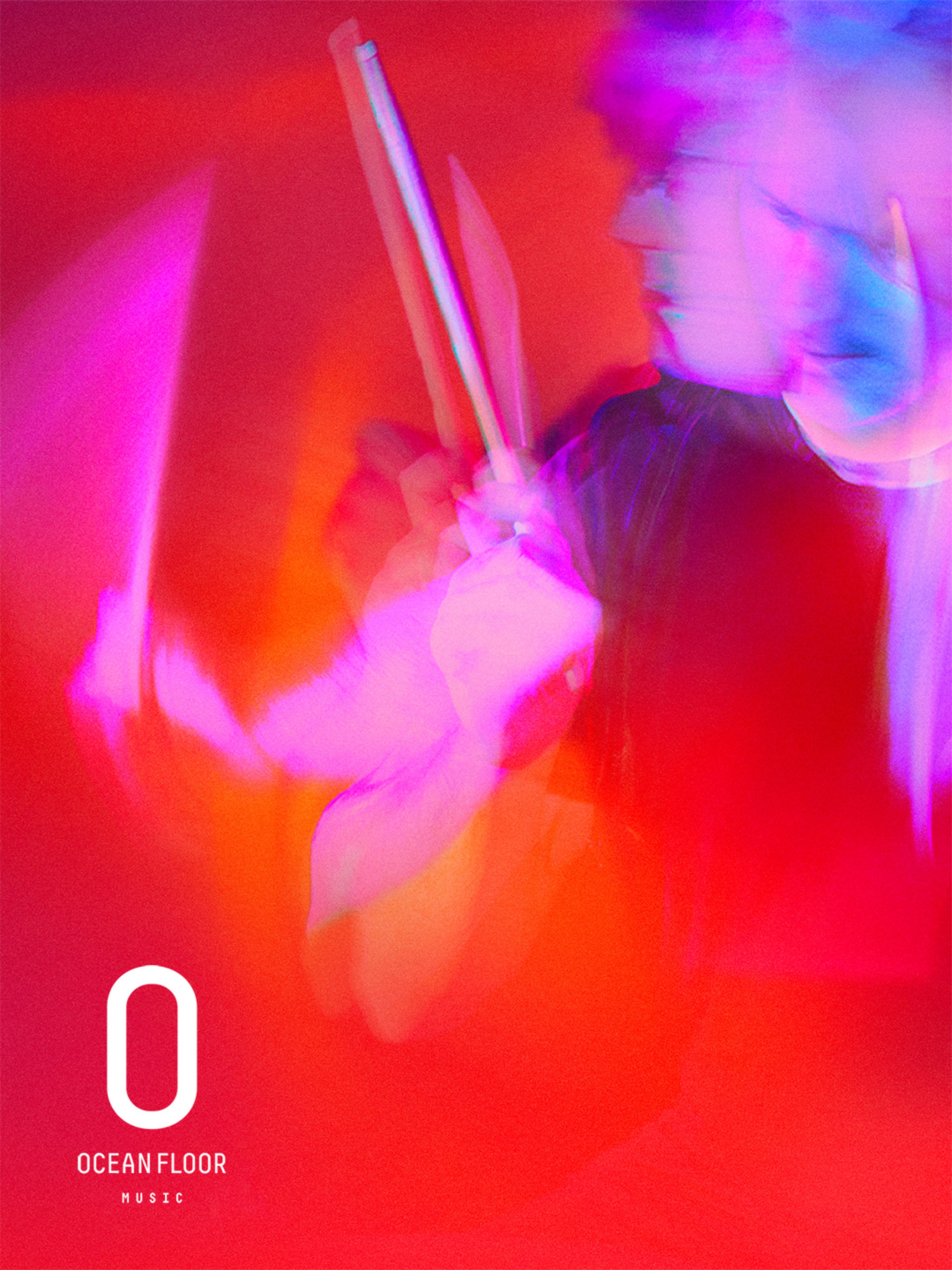 Campaign artwork: a drummer in red light with the Ocean Floor Music logo